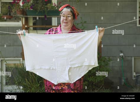 Woman Behind A Huge Pair Of Underwear On A Clothesline Stock Photo Alamy