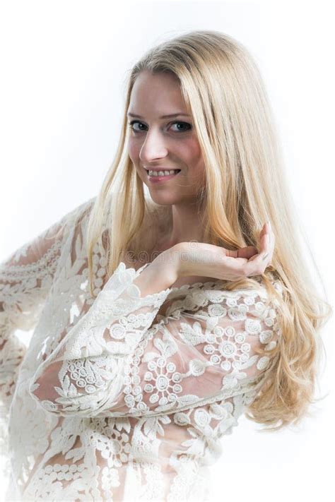 Beautiful Russian Blonde Girl On A White Background In A White Translucent Blouse Stock Image