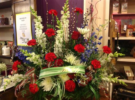 The importance of funeral flowers is what we take the most pride in. Red, White and Blue Funeral Arrangement | Funeral ...