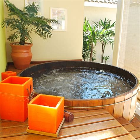 Very deep bathtub designed for full body immersion. Ofuro