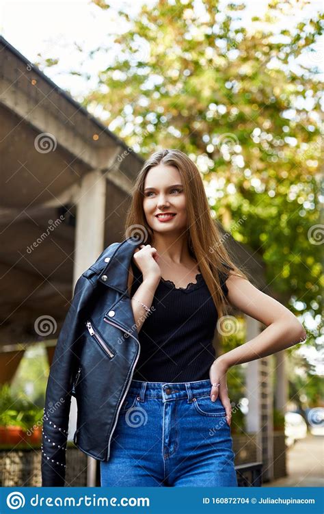 Face Portrait Of Attractive Woman In Black Leather Jacket Stock Photo