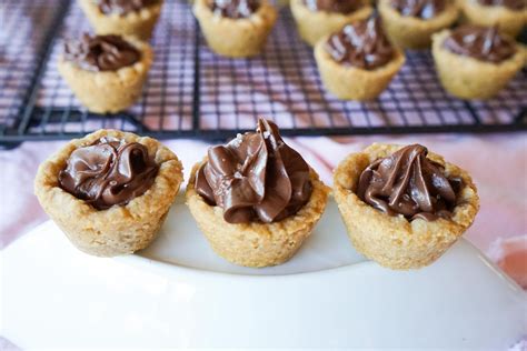 We may earn a commission through links on our site. Chocolate Peanut Butter Cookie Cups - Baking in Black and ...