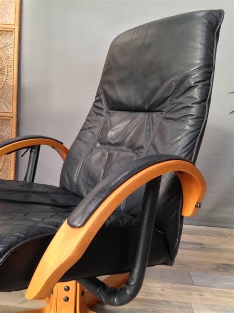 It's crafted with a solid and engineered wood frame in an inviting silhouette with sloped arms and a loose cushion back. Danish Design Wooden And Leather Recliner And Swivel ...