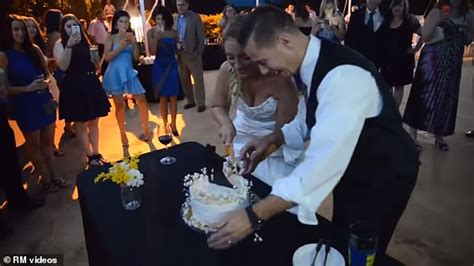 groom smashes cake into bride s face and sends her falling to ground big world news