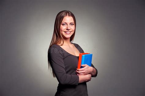 Young Woman Holding Two Books Stock Photo Image Of Standing Books