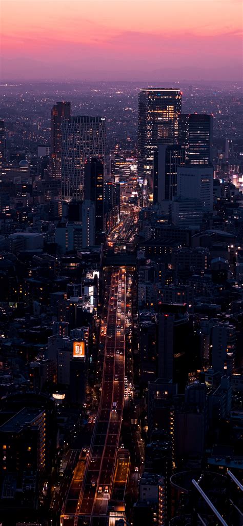 aerial view of city buildings during night time iPhone 11 Wallpapers