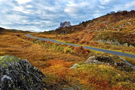A Winter View Of A Remote Winding Road Through The Colorful Moors And