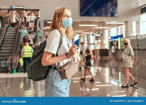 Blonde Hair Female Tourist With Baggage Near International Airport