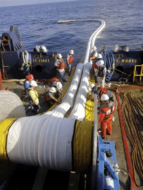 96 Deployment of a boom from the rear of a supply vessel. This is a