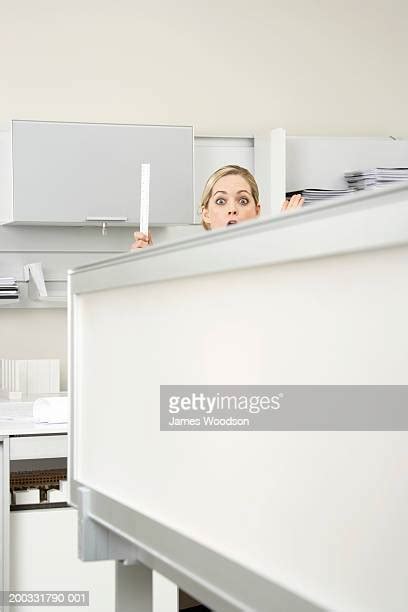 Woman Peeping Over Office Cubicle Photos And Premium High Res Pictures Getty Images