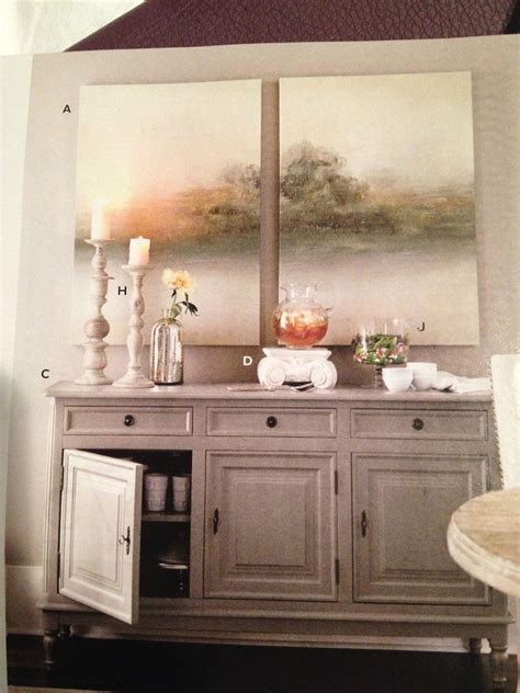 Lively conversation at your dinner parties excites the senses, and delicious food tingles the taste buds. Art over dining room buffet table | Dining room buffet ...