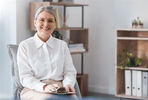 you can trust me shot of a mature psychologist sitting in her practice during the day stock