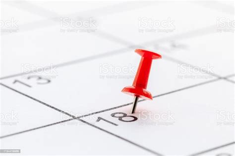 Red Push Pin On White Calendar Background Copy Space For Text Stock