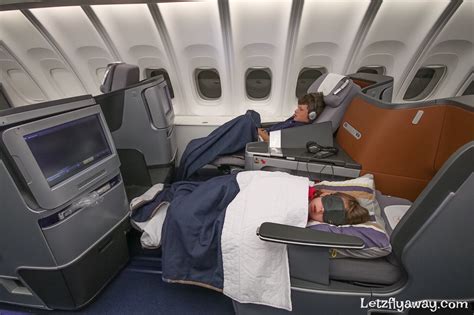 We quickly found our seats in row 85, located roughly in the center of the cabin, just behind the emergency exit row. Lufthansa Business Class Boeing 747-8 upper deck