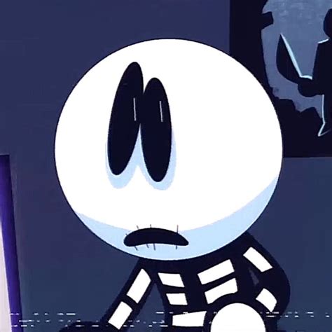 A Cartoon Character Sitting In Front Of A Computer Screen With An Evil Face On It