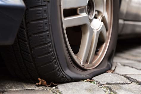 Damaged Flat Tire Of A Car Mobile Tyres 2 U