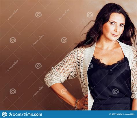 Pretty Brunette Confident Mature Woman Posing Cheerful On Warm