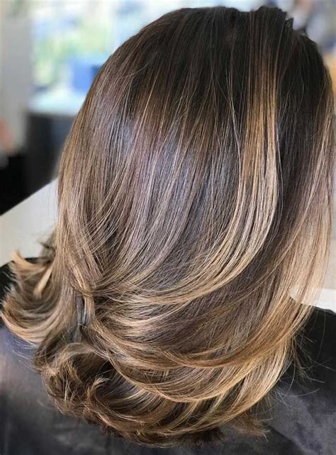 This layered cut displays a subtle dimension that shows off her highlights and has enviable texture. 49 Beautiful Light Brown Hair Color To Try For A New Look | Brunette hair with highlights ...