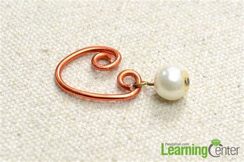 Make a wire and pearl hoop dangle against finger. Step-by-step Guide on Making Homemade Sweetheart Earrings ...