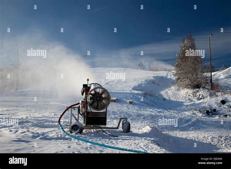 Machine Making Snow On A Ski Slope Stock Photo Alamy