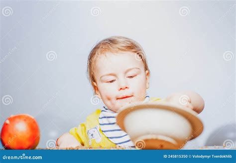 Cute Funny Babies Eating Baby Food Funny Kid Boy With Plate And Spoon