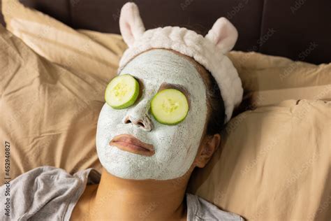 Face Focusing Of Young Beautiful Asian Woman Is Doing Facial Mask With