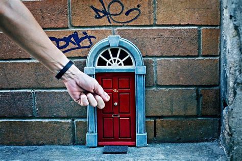 Brisbanes Tiny Door In Burnett Lane Unveiled As One Of Guerilla Artist