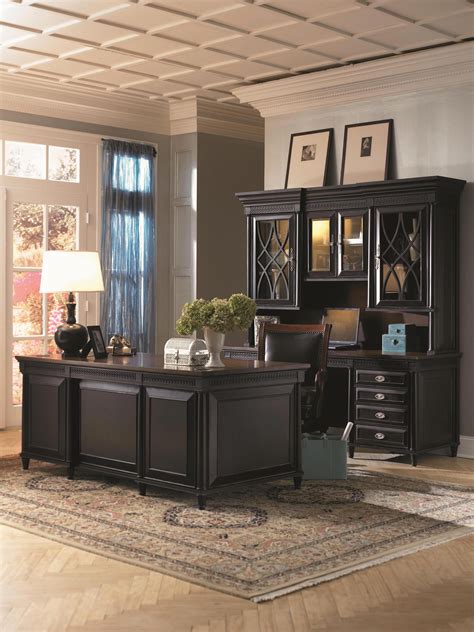 A Classy Home Office With A Beautiful Black And Brown Two Toned Desk