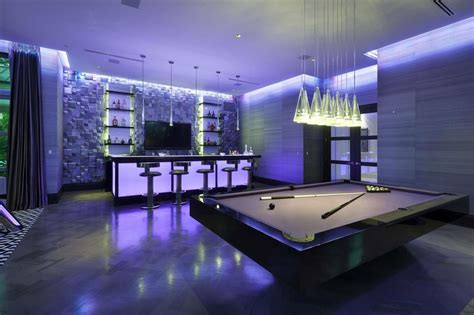 Modern Game Room With Chandelier And Hardwood Floors In