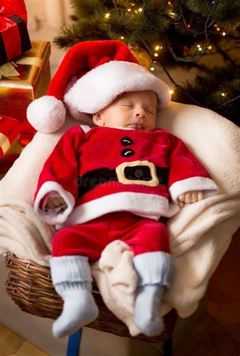 Newborn Baby Boy Santa Claus Costume Sleeping Basket Stock Photos