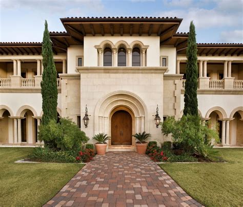 Tuscan House Style With Front Walkway And Italian Cypress Trees