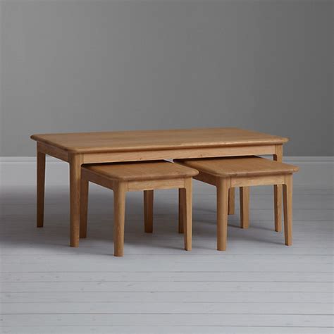 The frame of each piece is made of wood and bathed in a cherry finish. Hudson Coffee Table/Nest of 3 Tables