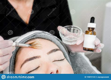 Close Up Of Beautician Cosmetologist Applying Chemical Peel Treatment