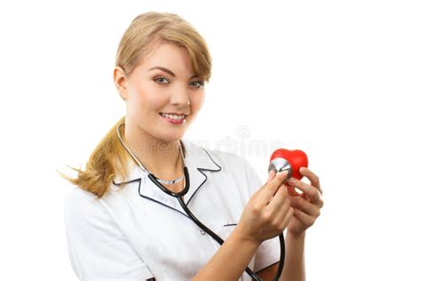 Woman Doctor With Stethoscope Examining Red Heart Healthcare Concept