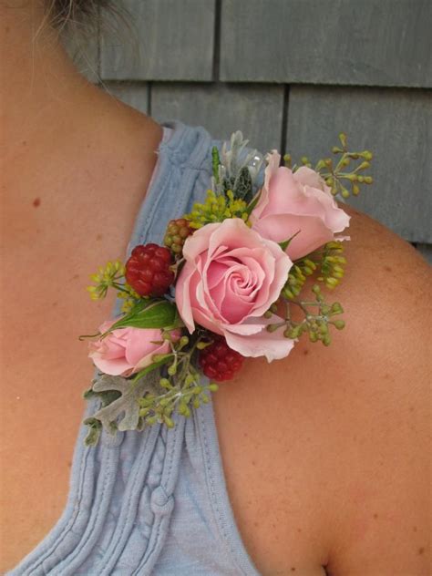 Diy a wedding starter pack for your mom by stuffing this faux leather clutch with everything she needs to get her through the day, including mints, bandages, and pain reliever. Summer shoulder corsage. Roses, Seeded Eucalyptus ...