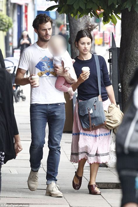 Fifty Shades Of Grey Actor Jamie Dornan Cradles Daughter With Wife