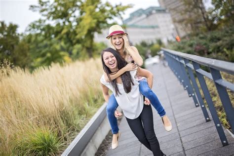 Two Beautiful Young Women Having Fun In The City Stock Image Image Of