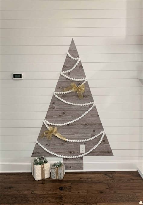 A beautiful sparkling christmas wall decorations ideas that you can make by using a styrofoam and glitter scrapbook paper. DIY Wall Christmas Tree Tutorial: Using Shelf Paper - thetarnishedjewelblog