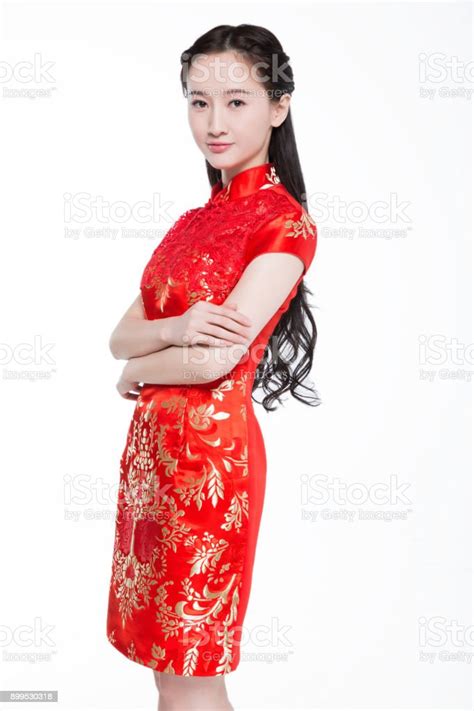 Beautiful Asian Woman In Red Cheongsam Standing On White Background