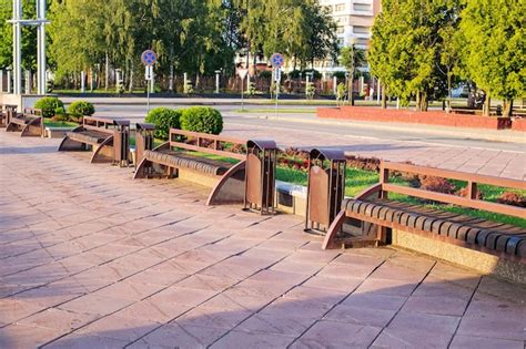 premium photo benches in the city park at sunset