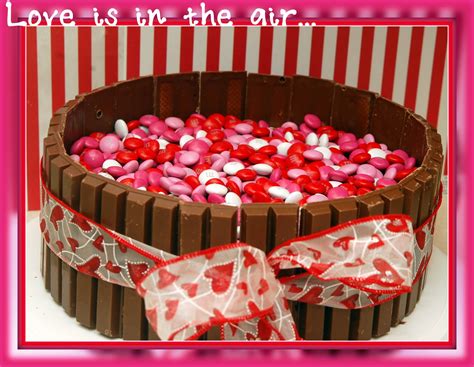 Happy birthday candles and balloons burning on a cake happy mother`s day, women`s day, valentine`s day or birthday pastel candy colors background. GUESS WHO IS HAVING BIRTHDAY? - Hugs and Cookies XOXO