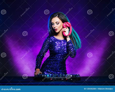 Young Beautiful And Dj Girl Playing Music On A Disco Party In A Night