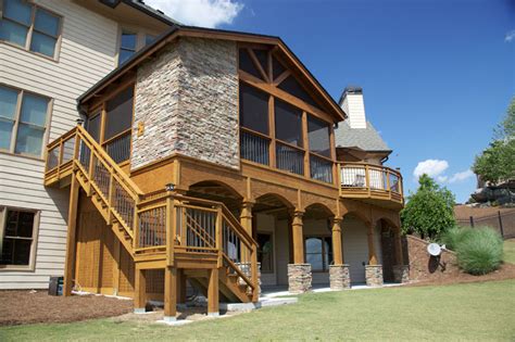 Maybe you would like to learn more about one of these? 2. Screened porch with corner fireplace - Tailor Decks