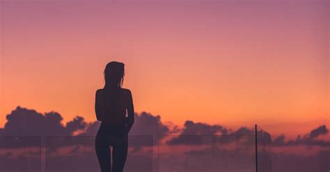Silhouette Of Woman Standing On Dock · Free Stock Photo