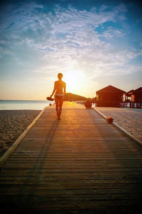 Silhouette Of A Girl Walking Along The Pier At Sunset Stock Image Image Of Pier Maldives