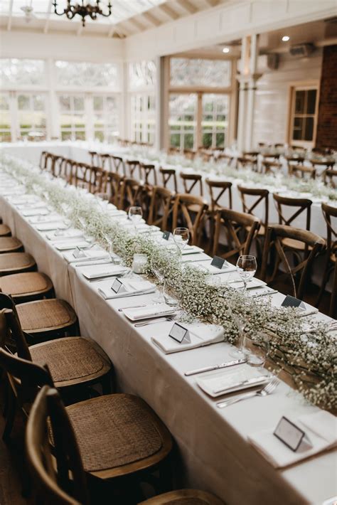 We Love The Way This Long Table Runner Of Babies Breath Flowers Looks
