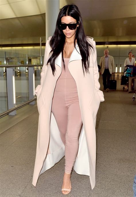 Pregnant Kim Kardashian Flies In A Pink Unitard No Makeup Photos Us