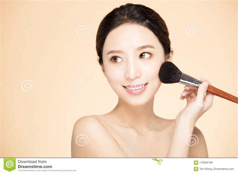 Woman Doing Make Up On Face With Cosmetic Brush Stock Photo Image Of