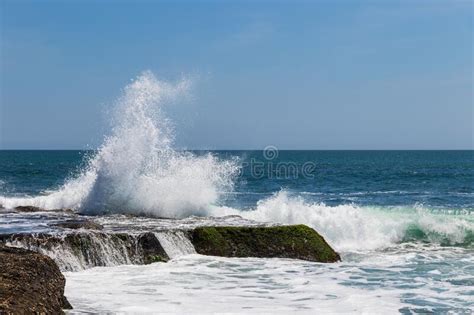 Wave Breaking On Rock Bali Indonesia Blue Ocean And Sky In