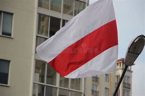 The White Red White Flag Of Belarus Flies Over A Living Apartment In